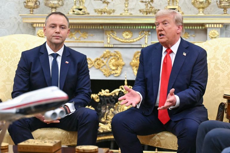 US President Donald Trump hosts Polish President Karol Nawrocki (L) in the Oval Office at the White House in Washington, DC on September 3, 2025.