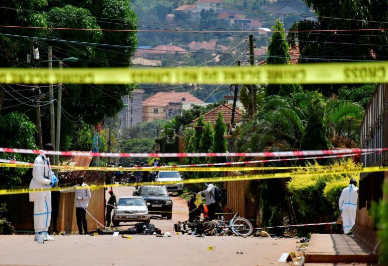 SENSITIVE MATERIAL. THIS IMAGE MAY OFFEND OR DISTURB Forensic experts secure the scene of a bomb blast near the Munyonyo Martyrs' Shrine, a Roman Catholic shrine as Ugandans assembled to celebrate Martyrs' Day, which commemorates Christians who were killed for their faith in the 19th century, in Munyonyo suburb of Kampala, Uganda June 3, 2025. REUTERS/Abubaker Lubowa TPX IMAGES OF THE DAY